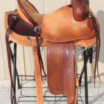 Rancher - 15.5 in, latigo, 2-tone, dark straight-back, floral, Diamond w barbed wire border, full bskt wv, strp lthrs out and tooled $2875