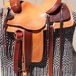Roper - 15.5 seat, mule hide, cheyenne roll, 2-tone, floral conchos, corner basket wv, barbed wire w Santa fe diamond border, $2,400 (3)
