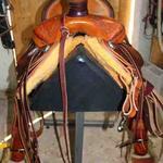 Rancher - latigo, barbed wire w channels, dark straight-back, rope strap, bell stirrups