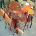 Trainer - mule hide, corner bskt wv, gun scabbard, floral, brass oxbows, straight-back,, sswirl w channels