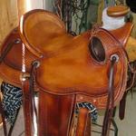 Wade - mule hide, bucking rolls, rope strap, straight-back, corner bskt wv, floral, bskt wv border