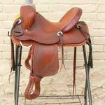 Youth Trainer - cheyenne roll, corner bskt wv, all dark leather, floral, mule hide, youth stirrups, sswirl with scallop border