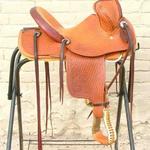 Youth Trainer - full basket weave, oak leaves, latigo, dark cheyenne roll, floral, youth stirrups, leathers under, leather roll on front